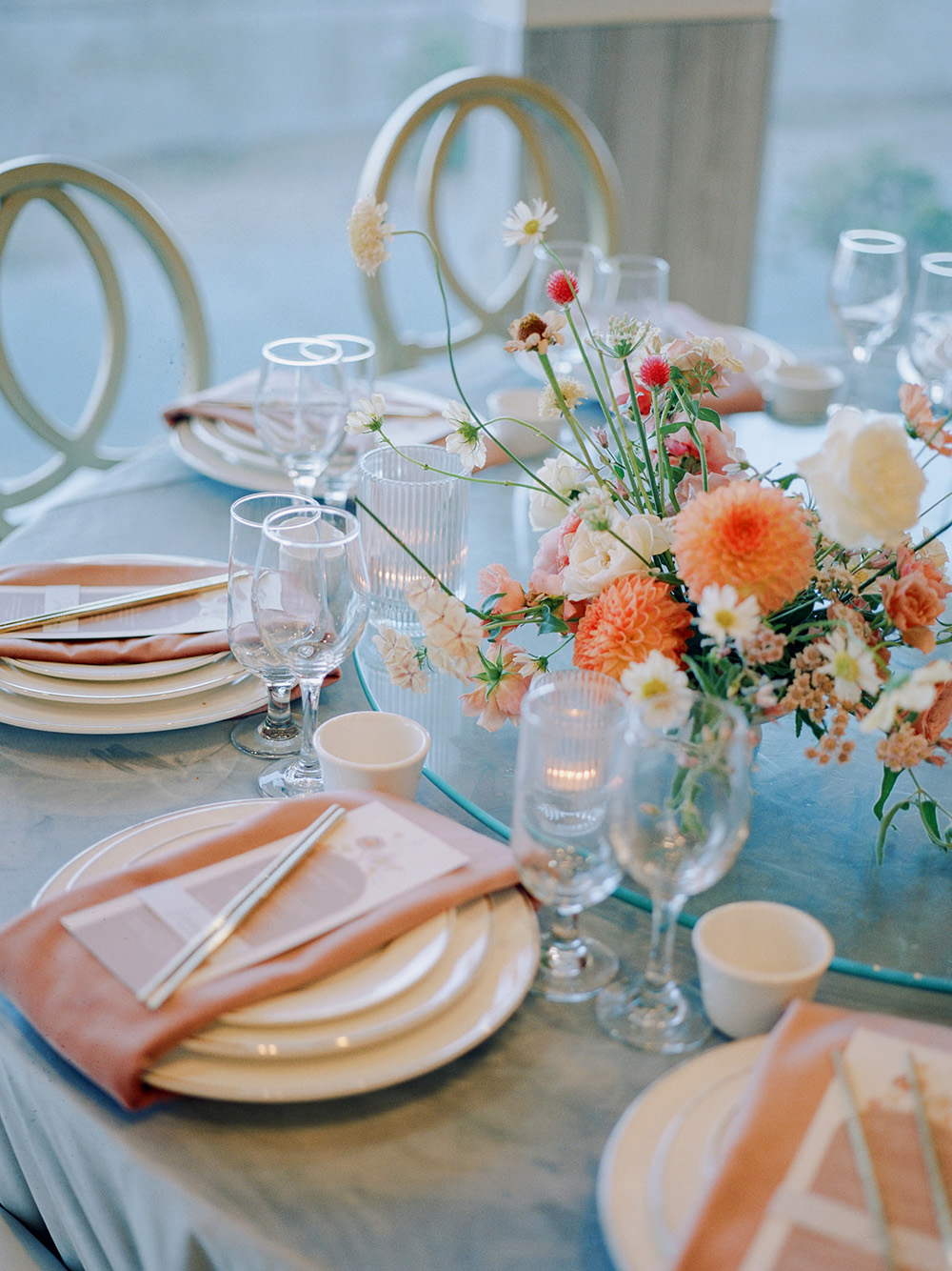 blush and white place settings for restaurant wedding reception