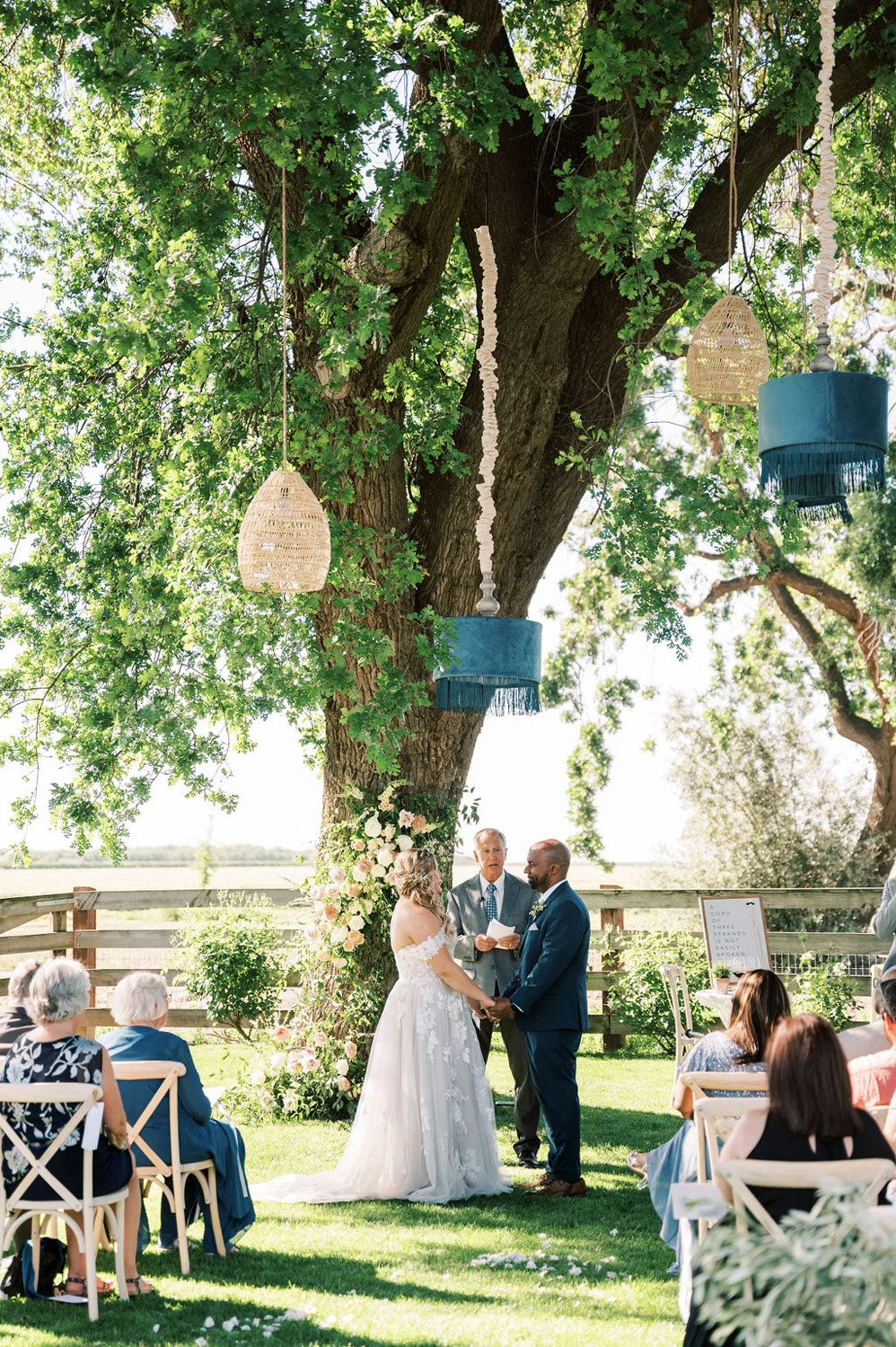 hanging lanterns at rustic wedding ceremony