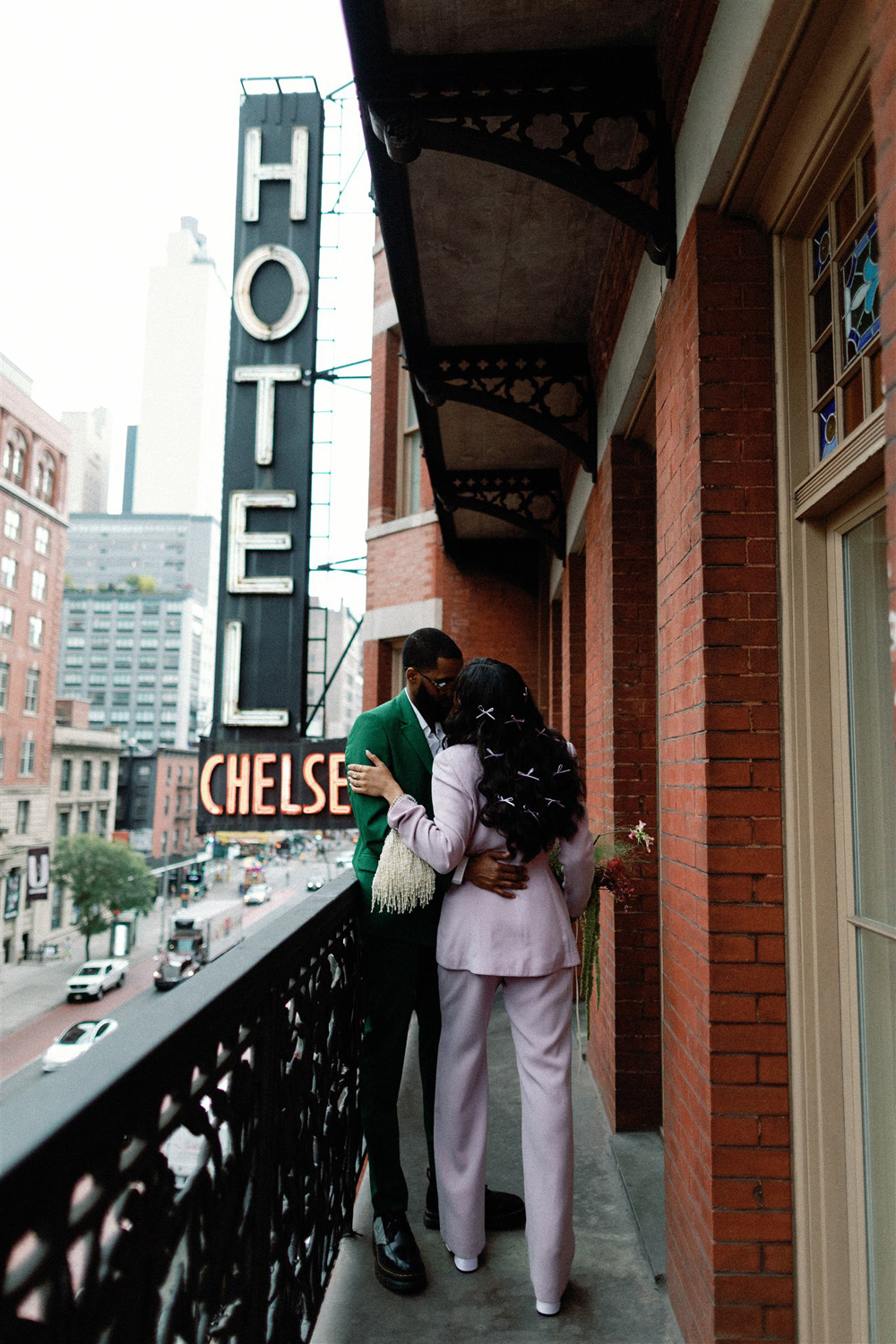 bride in bows and lavender suit and groom in green suit