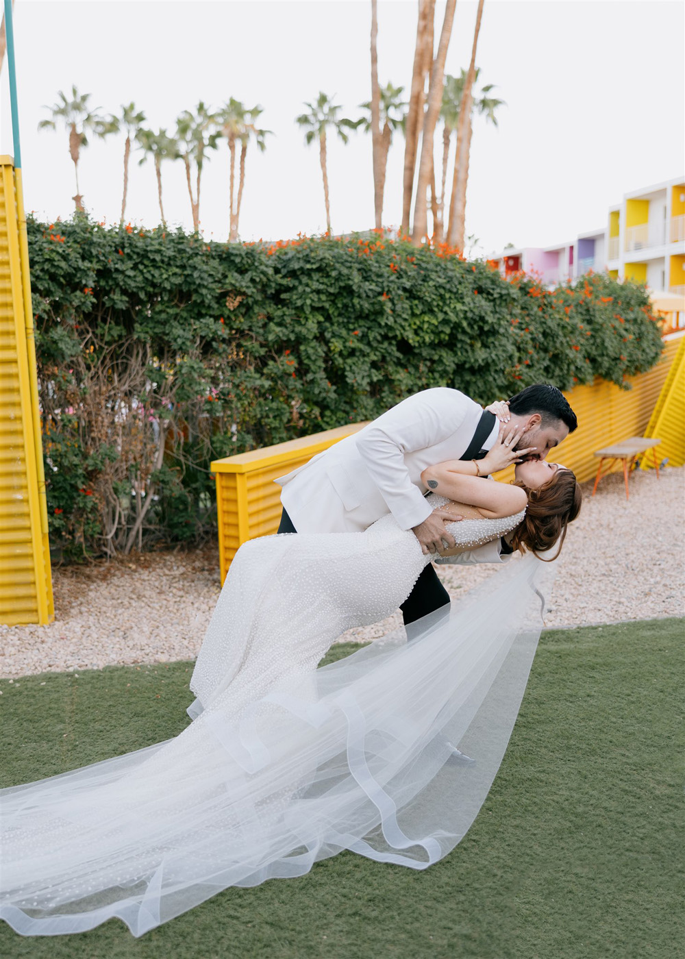 bride and groom kiss