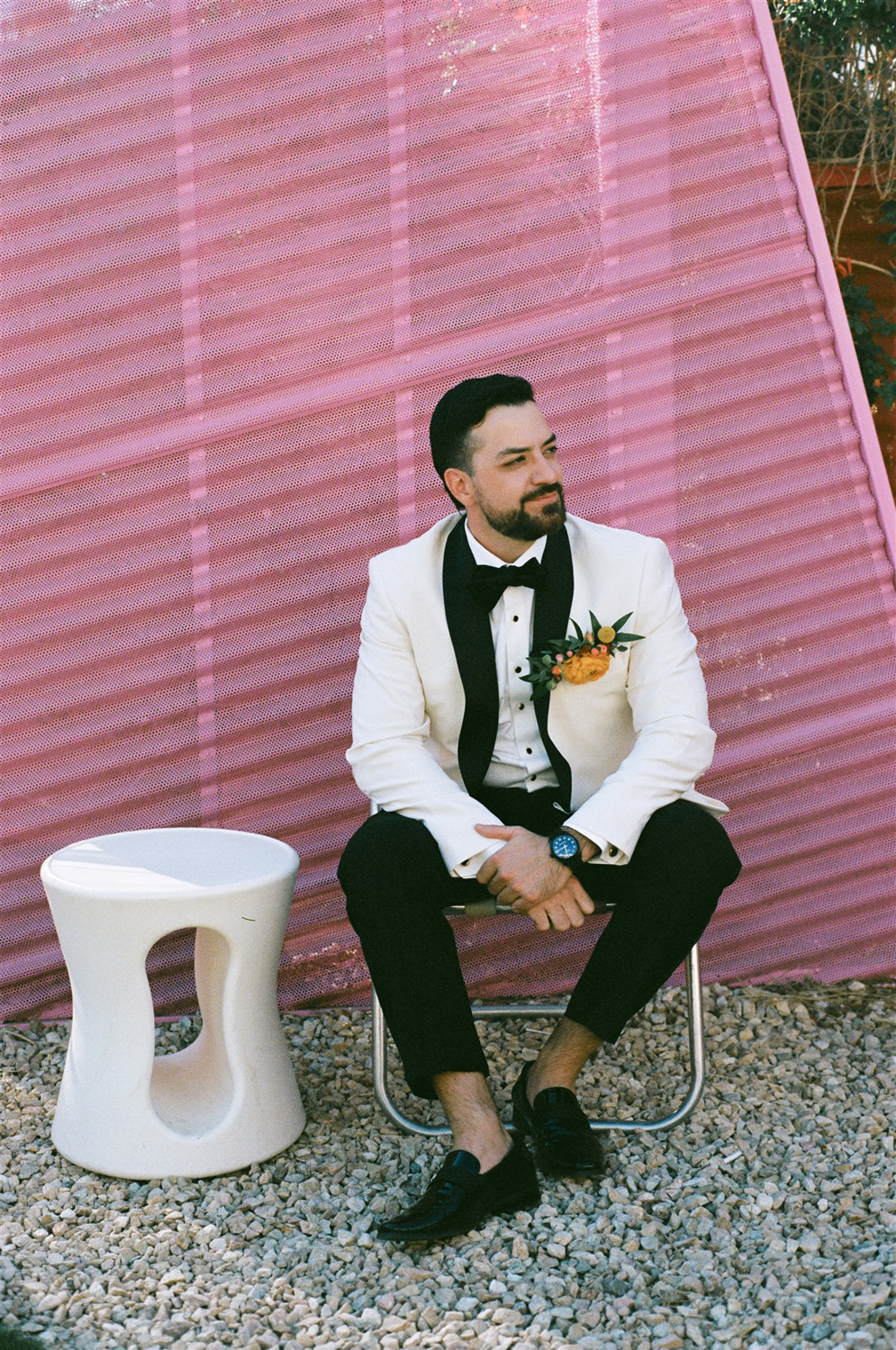 groom in white and black tux