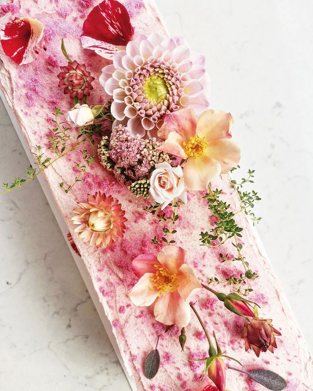 long pink floral runner style wedding cake