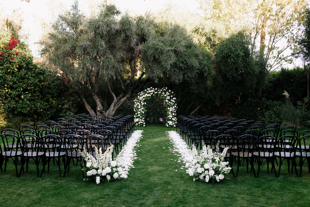 black and white ceremony with all white flowers