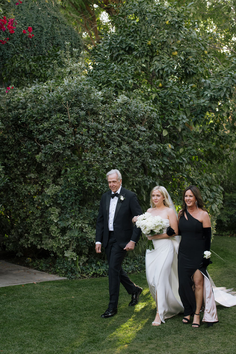 bride and parents walking down aisle at Parker Palm Springs wedding