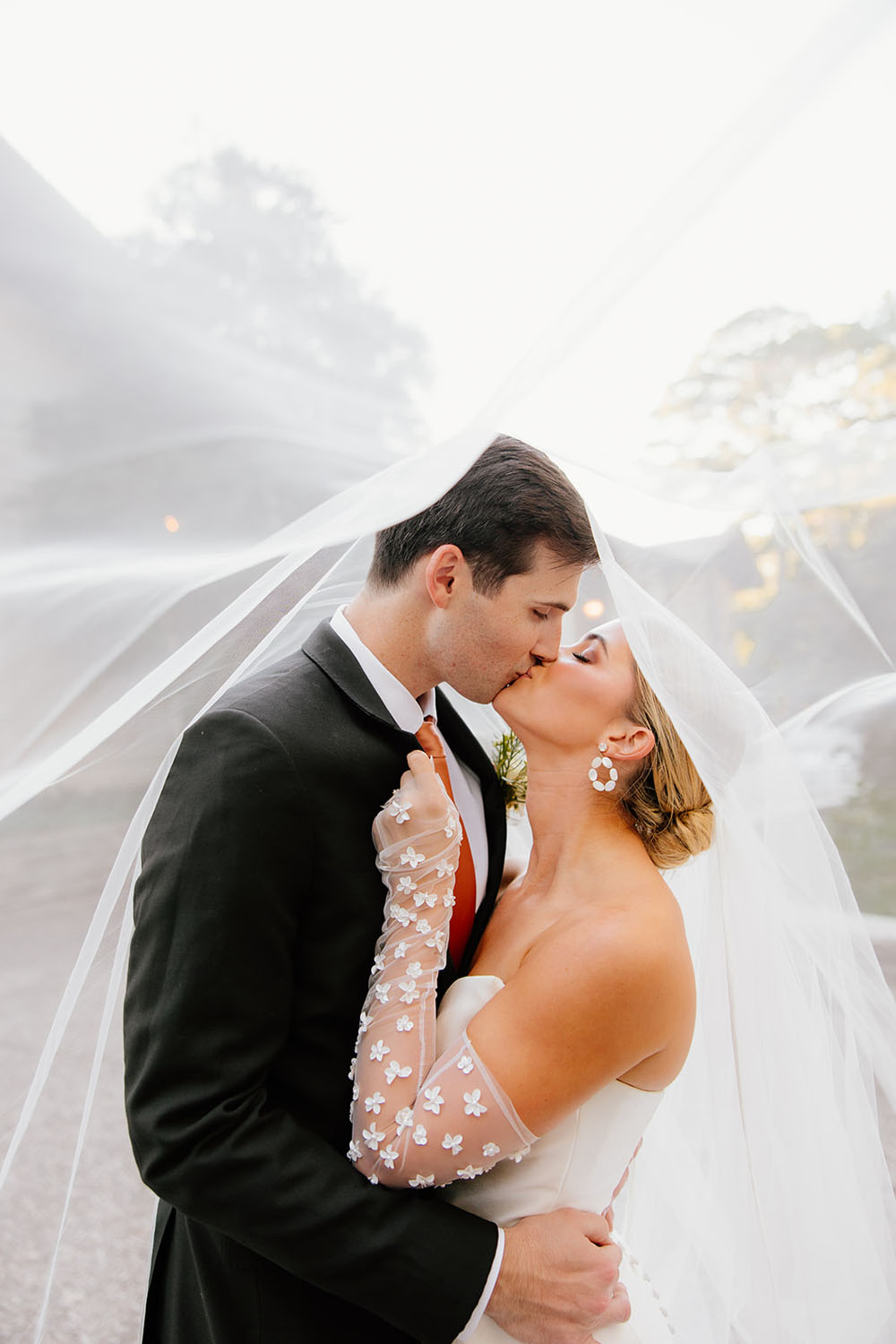 bride and groom portrait under veil