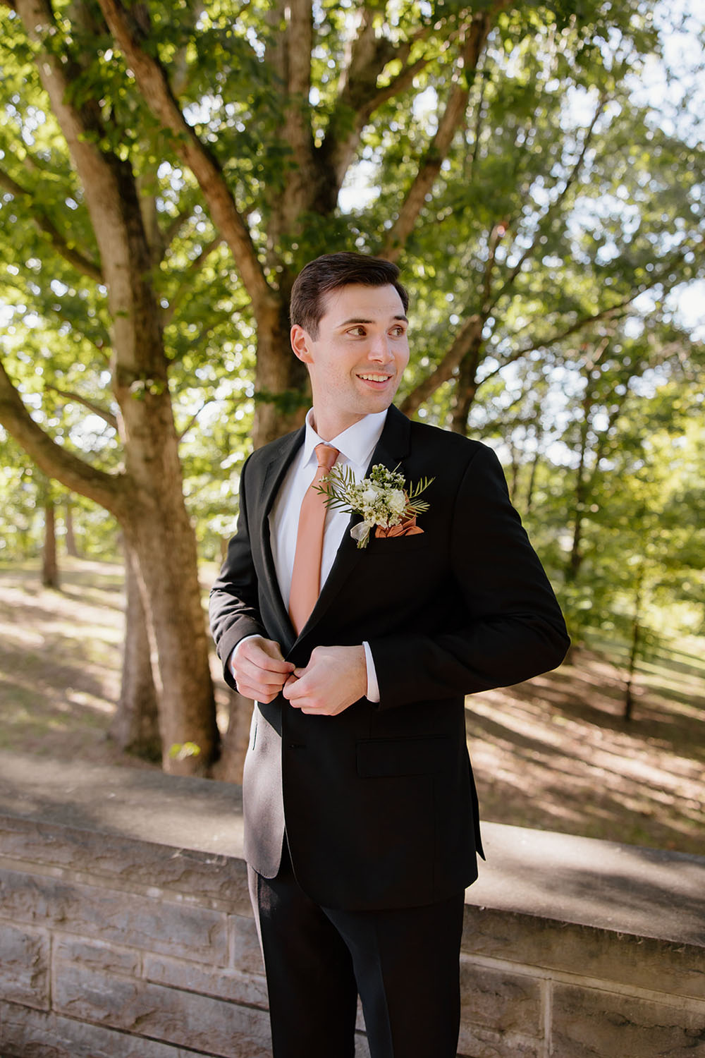 groom portrait with rust tie in fall wedding