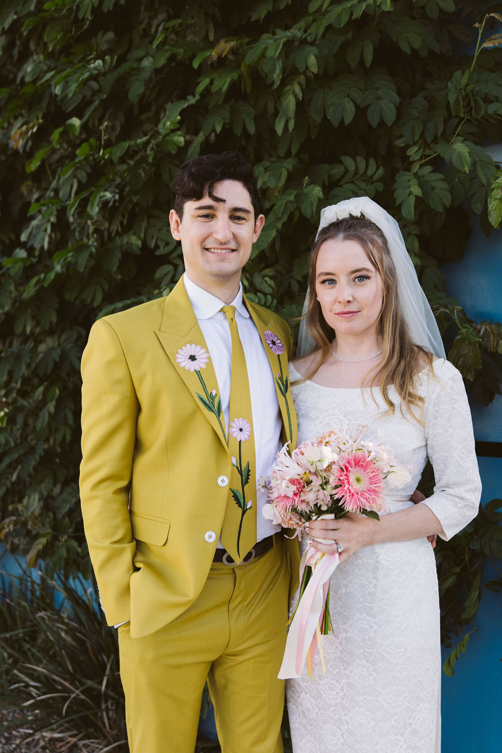 1960s inspired retro wedding portraits with groom in yellow floral suit