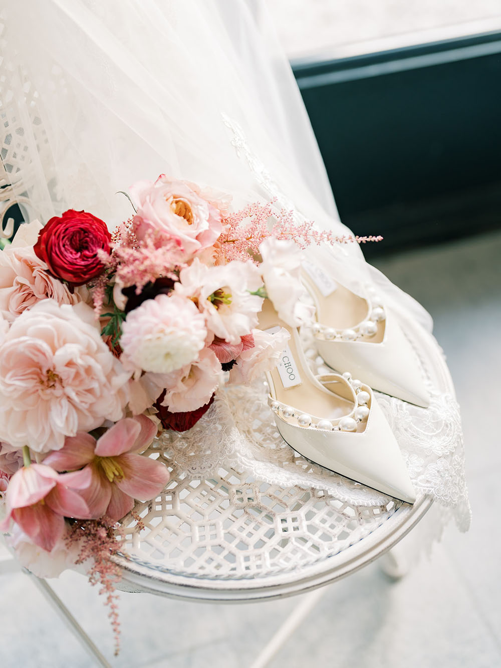 white spring wedding bouquet with pearl jimmy choo wedding shoes