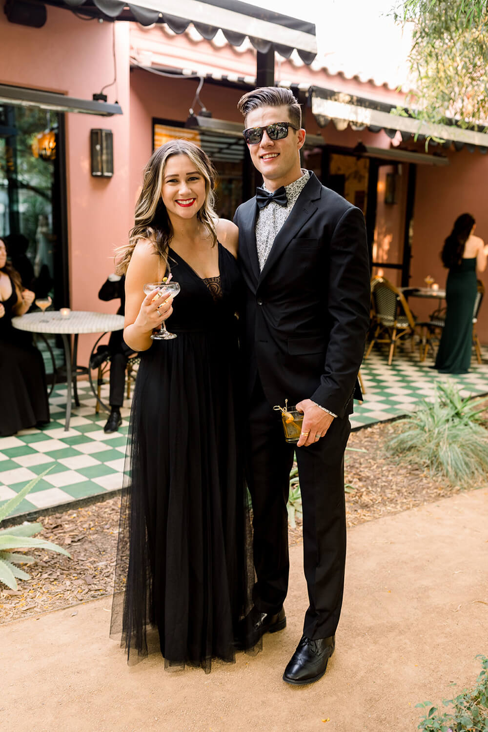Black wedding guest dress and tux