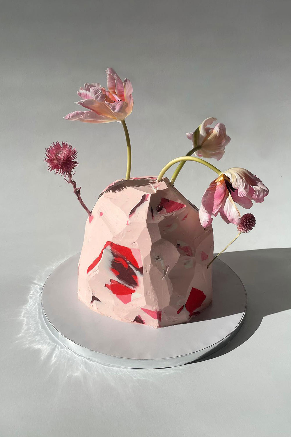 pink carved rock cake by  Amy Yip @yip.studio_