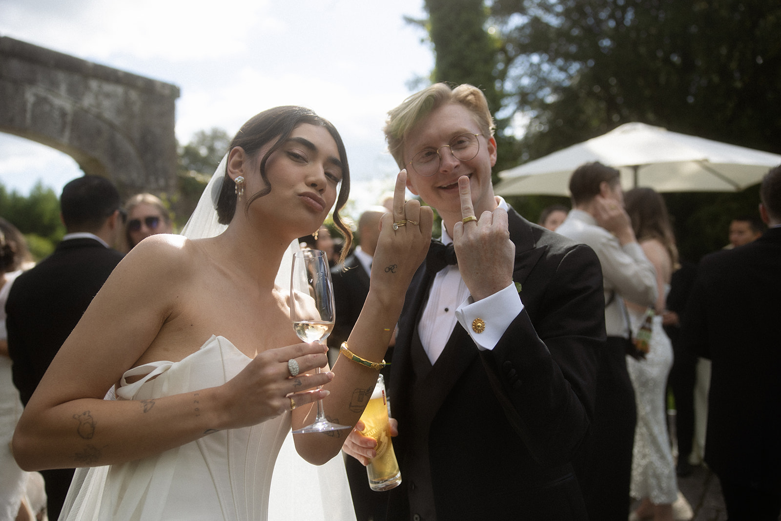 bride and groom showing ring fingers