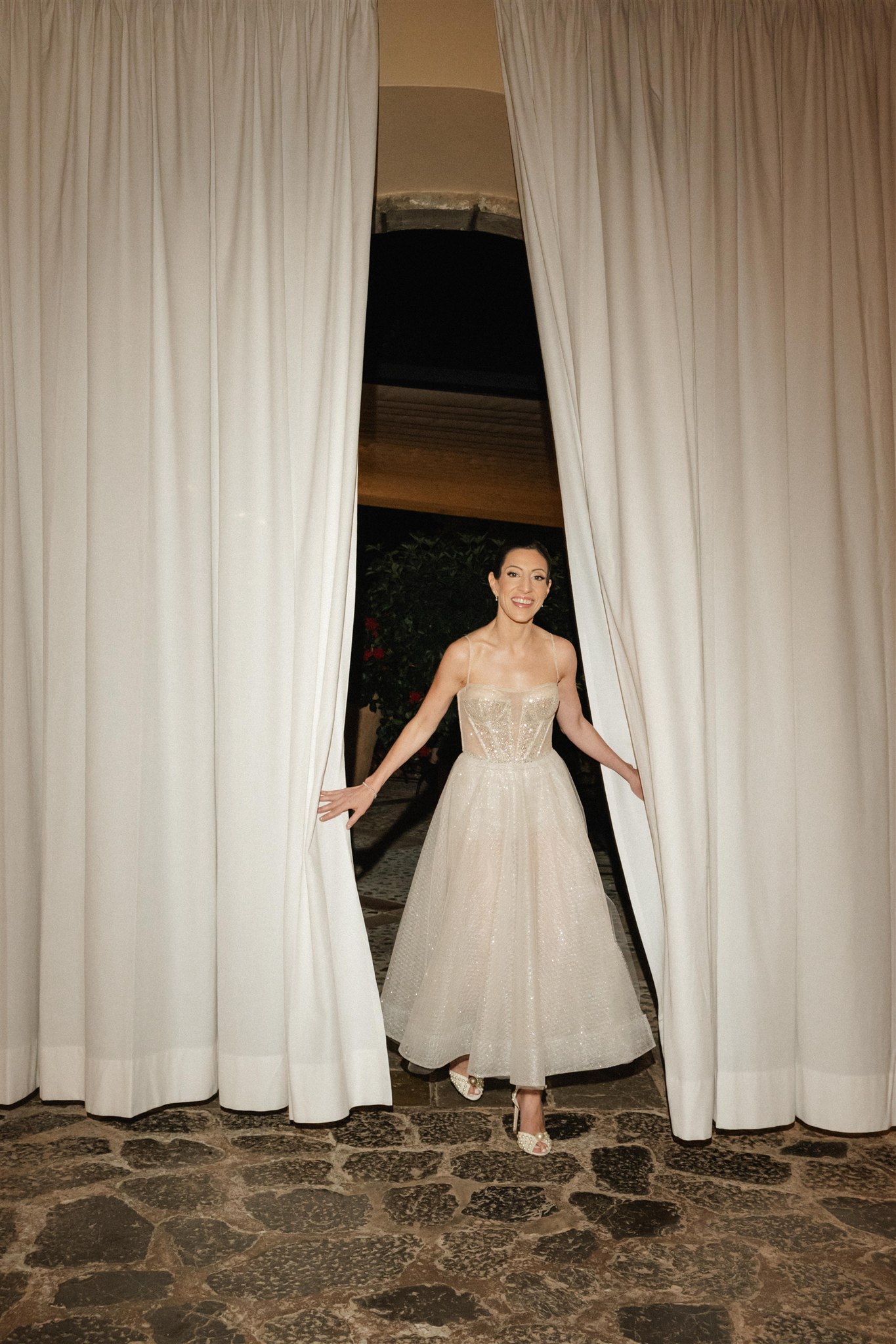 Bride changing into second Berta gown before wedding cake cutting and dancing