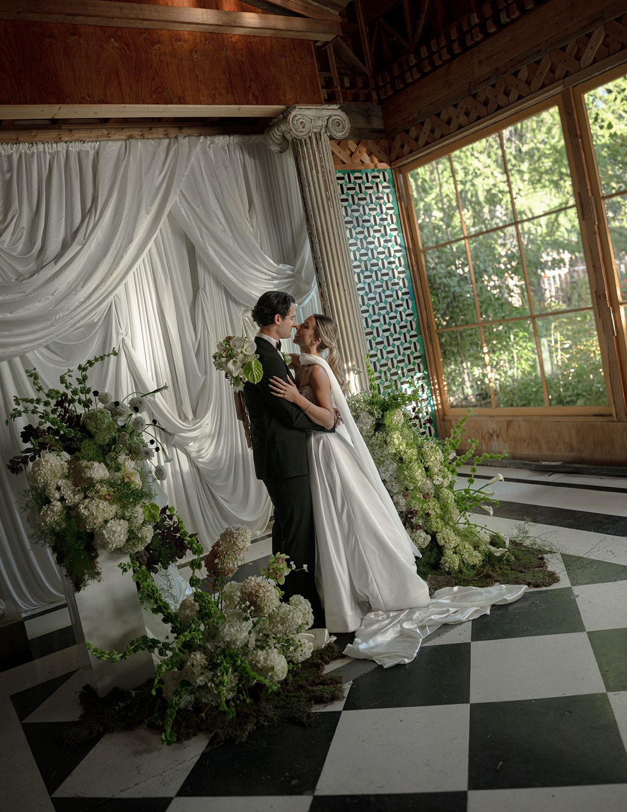 bride and groom with ceremony draping