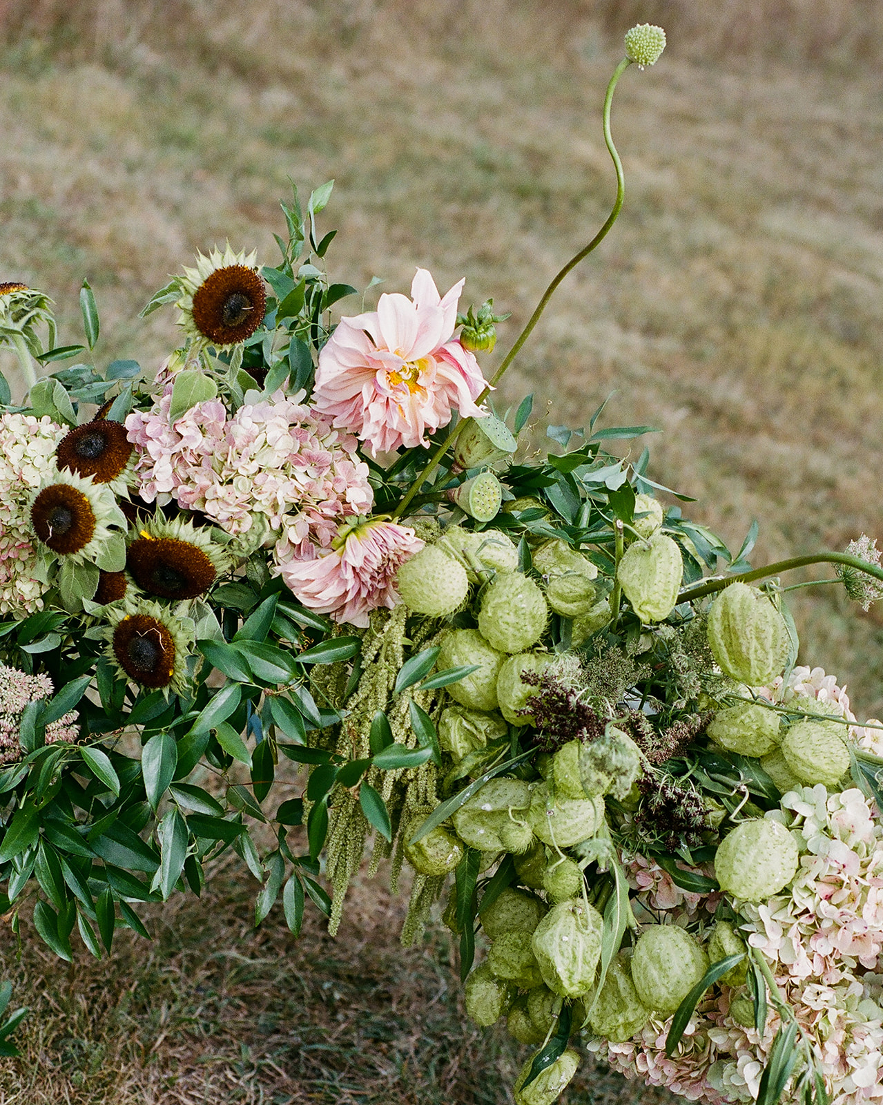 Unique, organic floral arrangements designed for a private estate wedding in Vermont with a vintage, timeless aesthetic