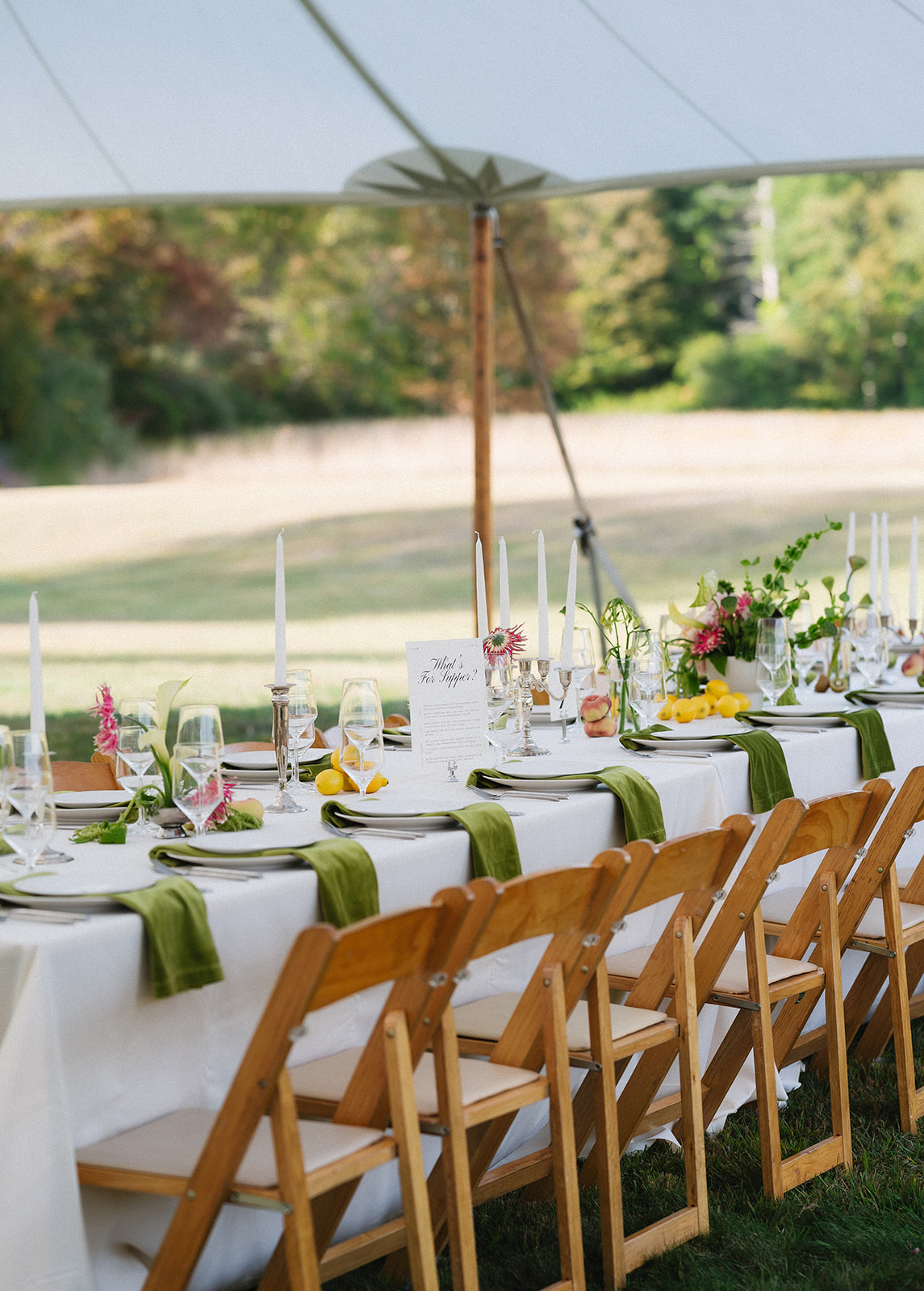Romantic wedding reception at a private Vermont estate featuring vintage tables, classic florals, and an untraditional layout