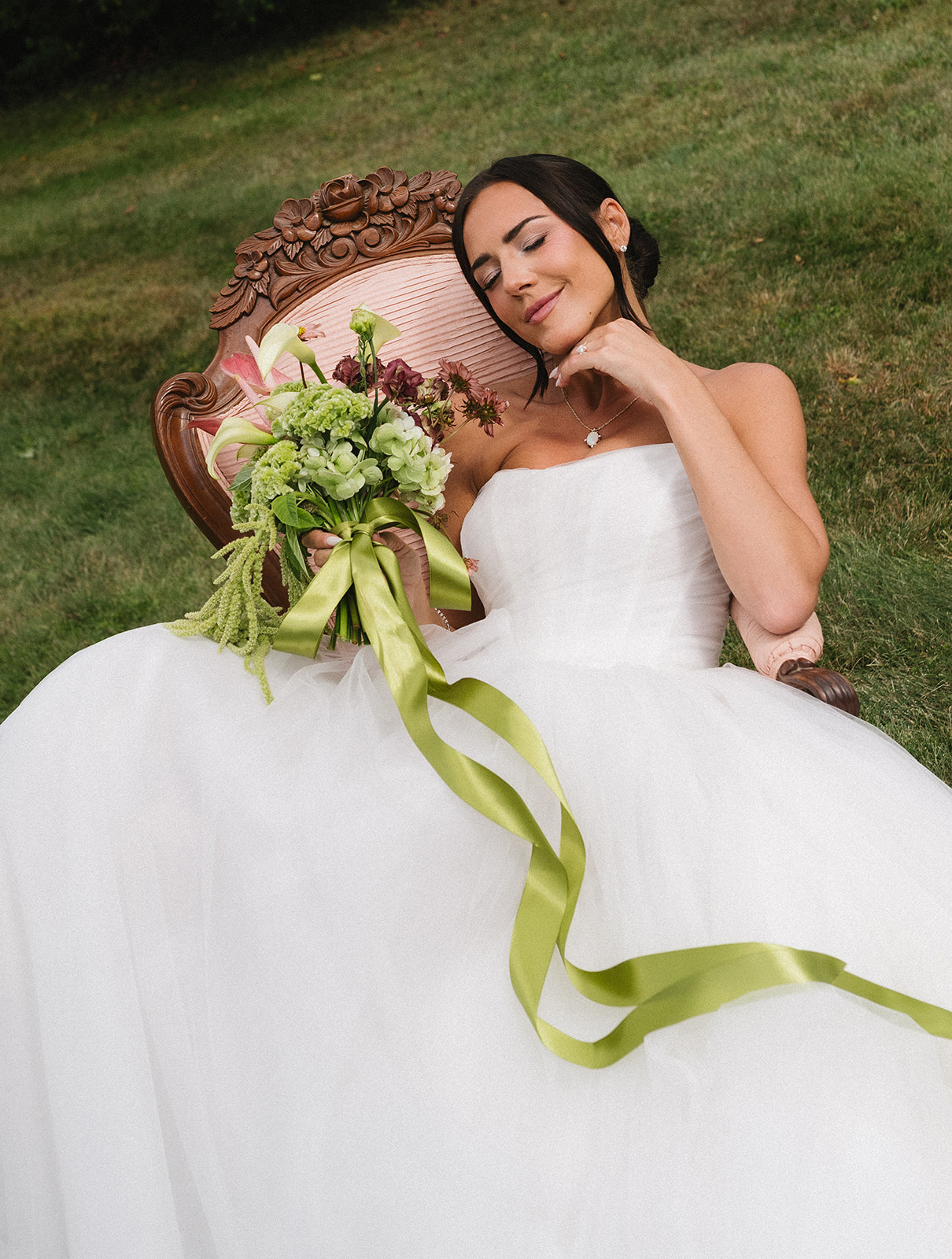 Bride holding a vintage-inspired bridal bouquet with organic florals at a private estate Vermont wedding