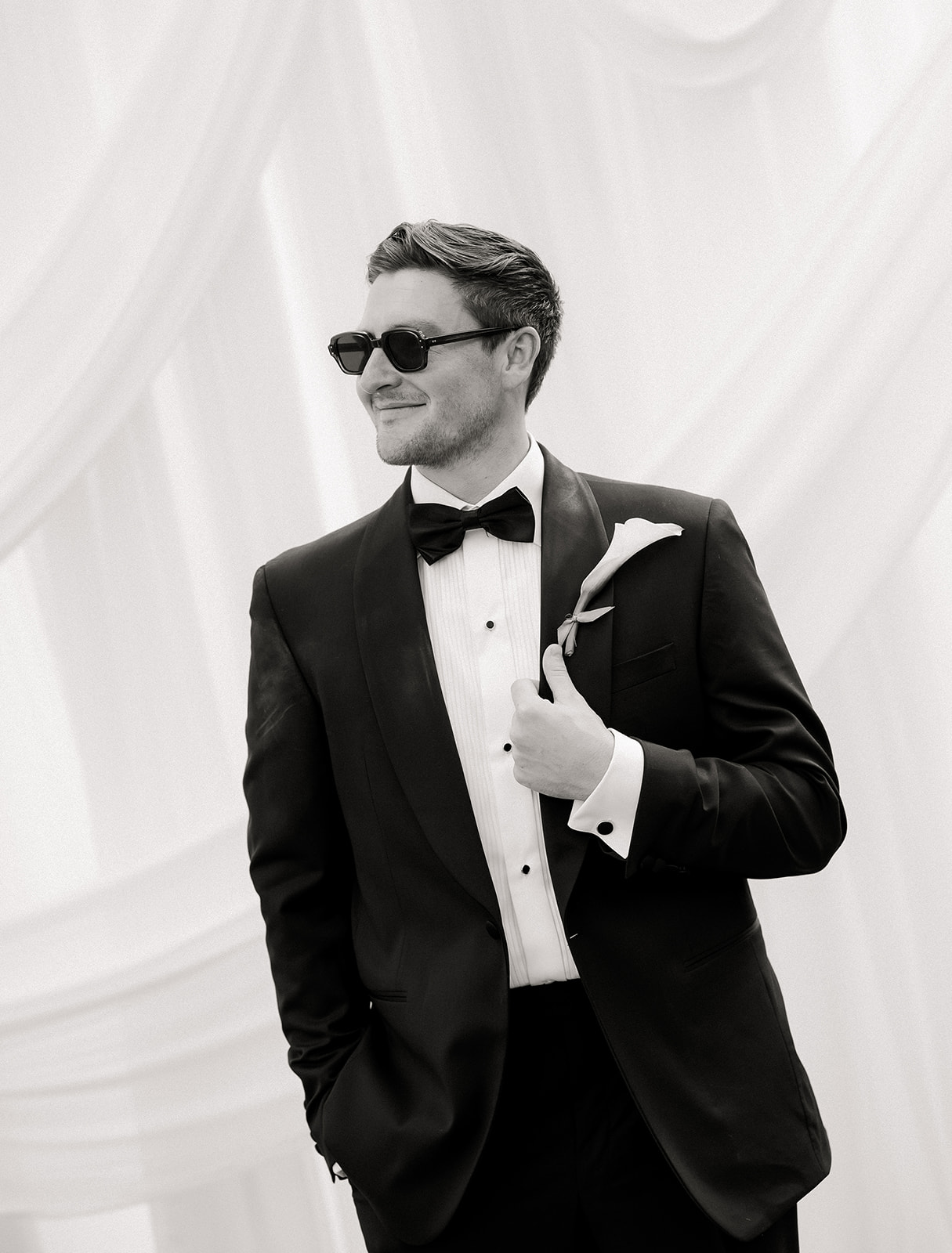 Groom in a classic, timeless suit photographed at a private estate wedding in Vermont