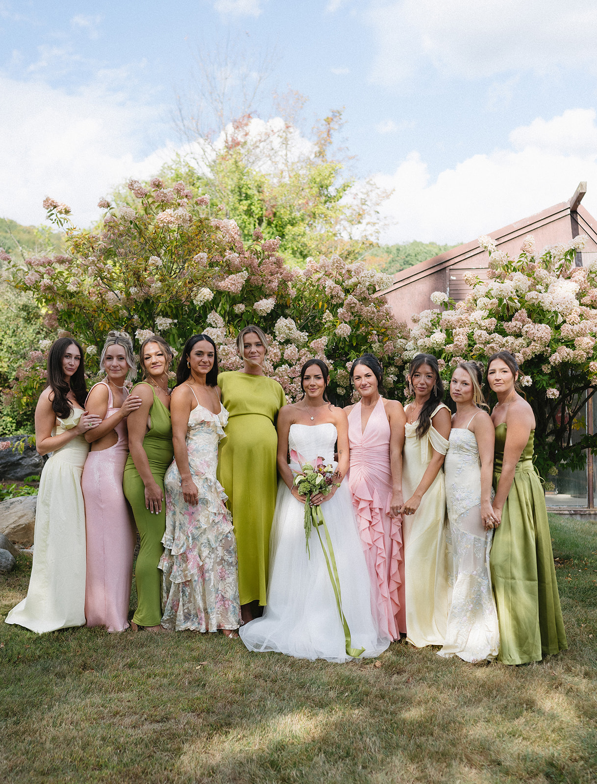 Bridesmaids styled in classic, understated looks at a private estate Vermont wedding with an editorial feel
