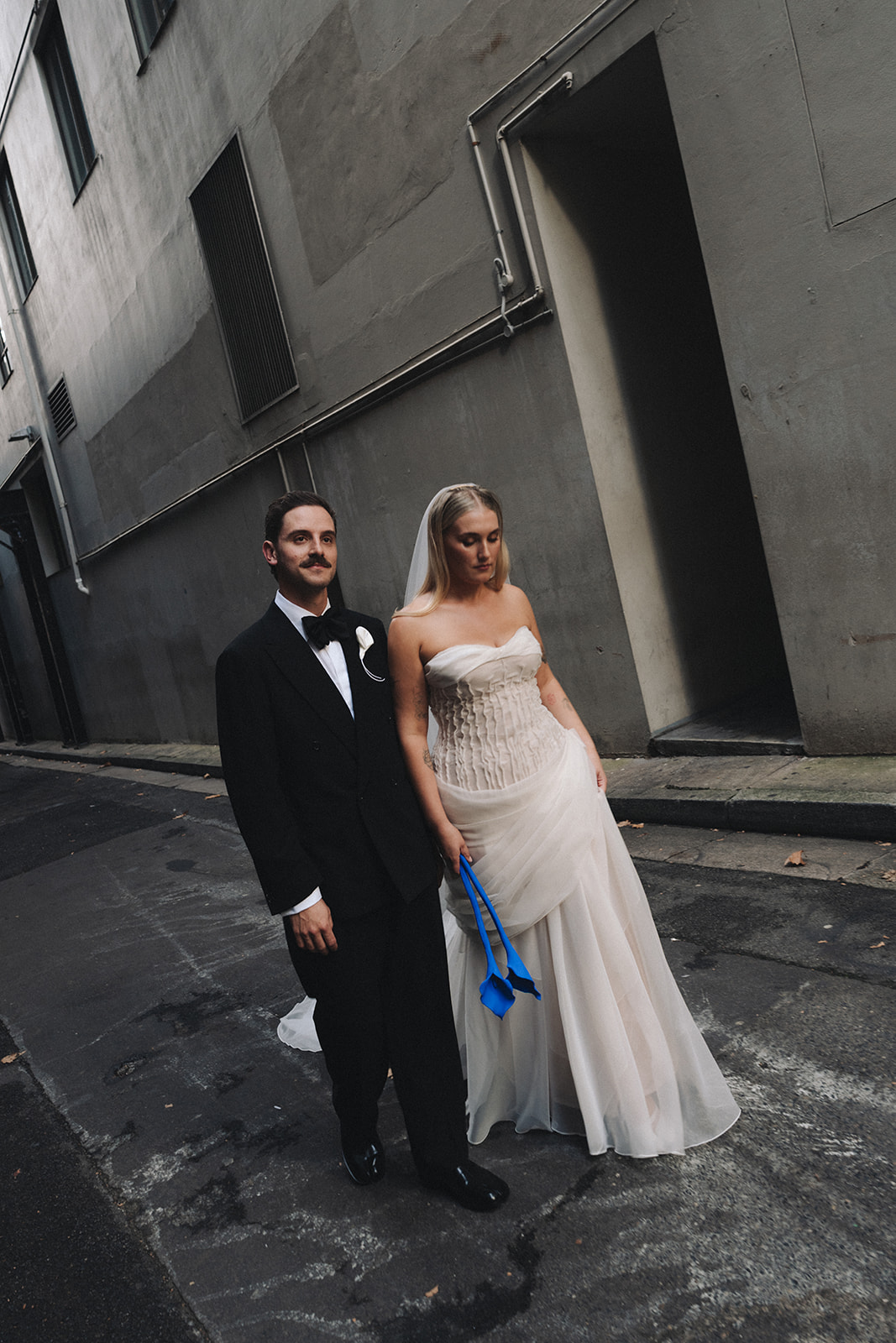 Bride and groom walking through Sydney after their restaurant wedding ceremony