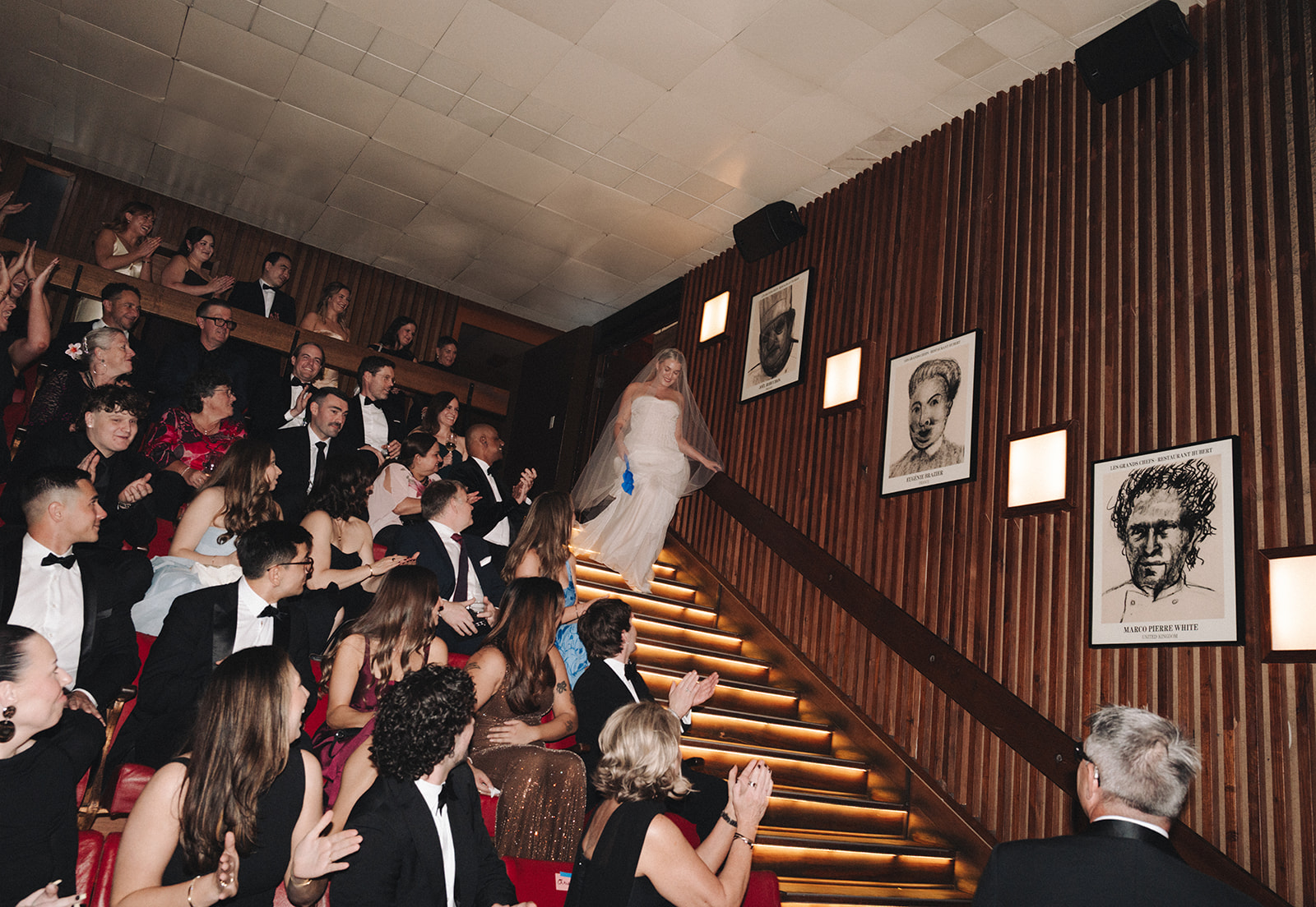 Intimate theatre wedding ceremony at Hubert Sydney with red velvet backdrop and blue carpet aisle
