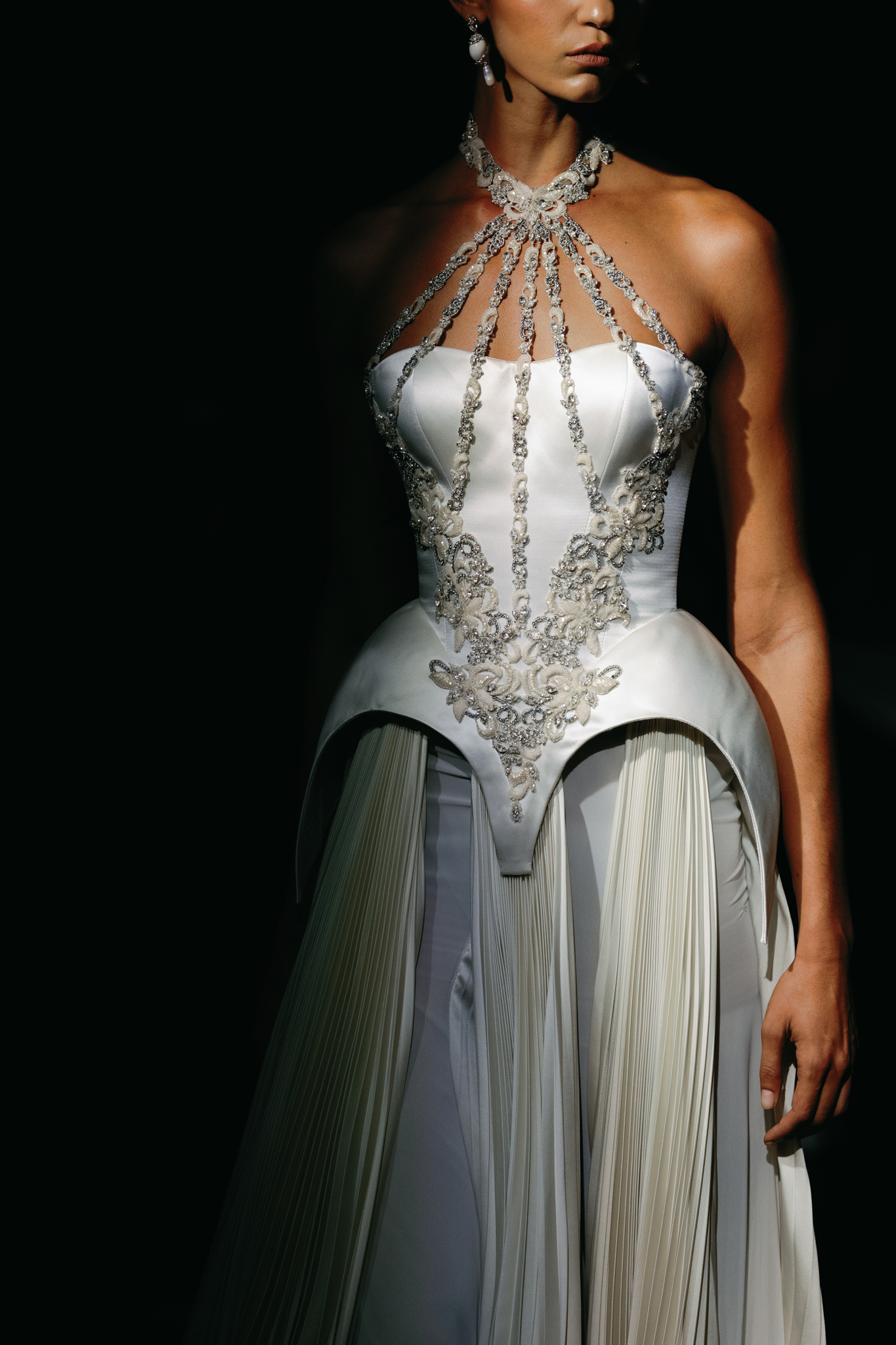 Close-up of hand-executed embroidery and ornate embellishments on an Alon Livné Fall 2027 bridal gown