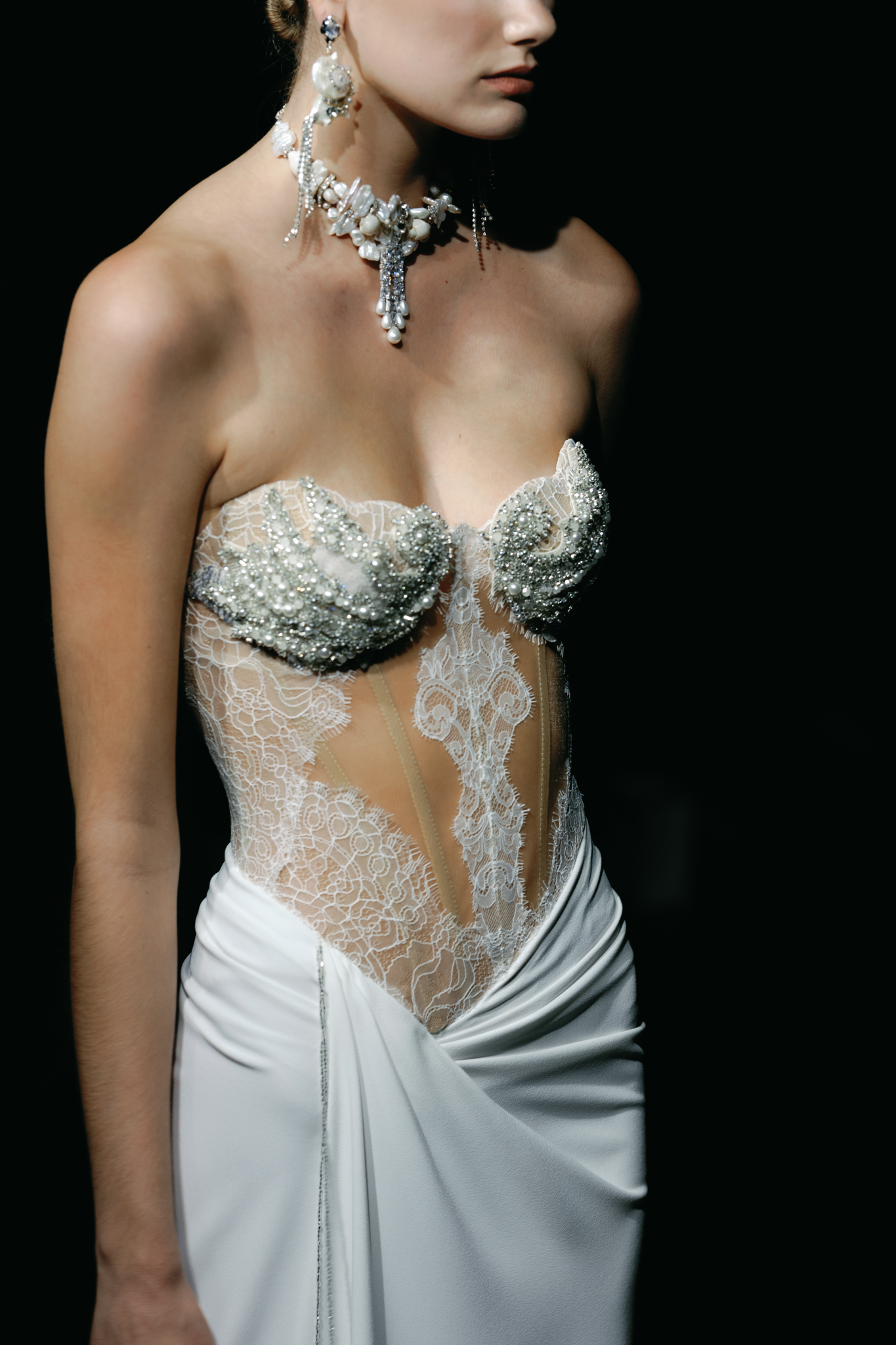 Statement bridal jewelry by Cassuto Jewels styled with an Alon Livné Fall 2027 wedding gown